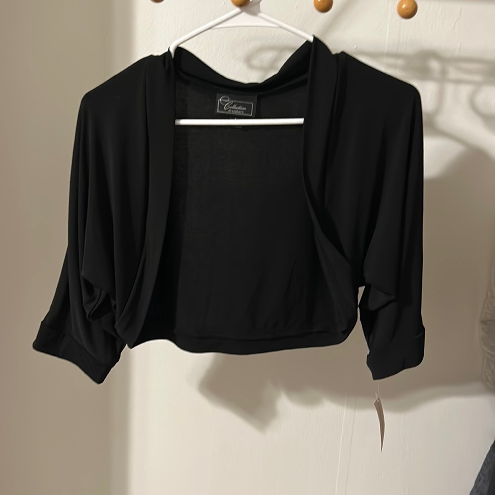 A black quarter sleeved opened top